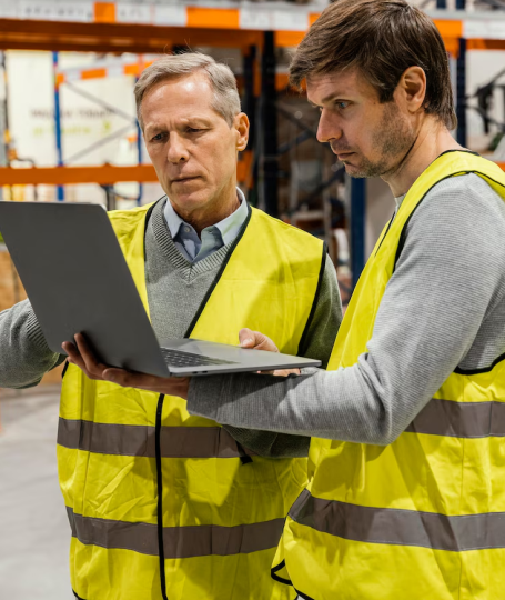 Manufacturing professionals reviewing equipment options